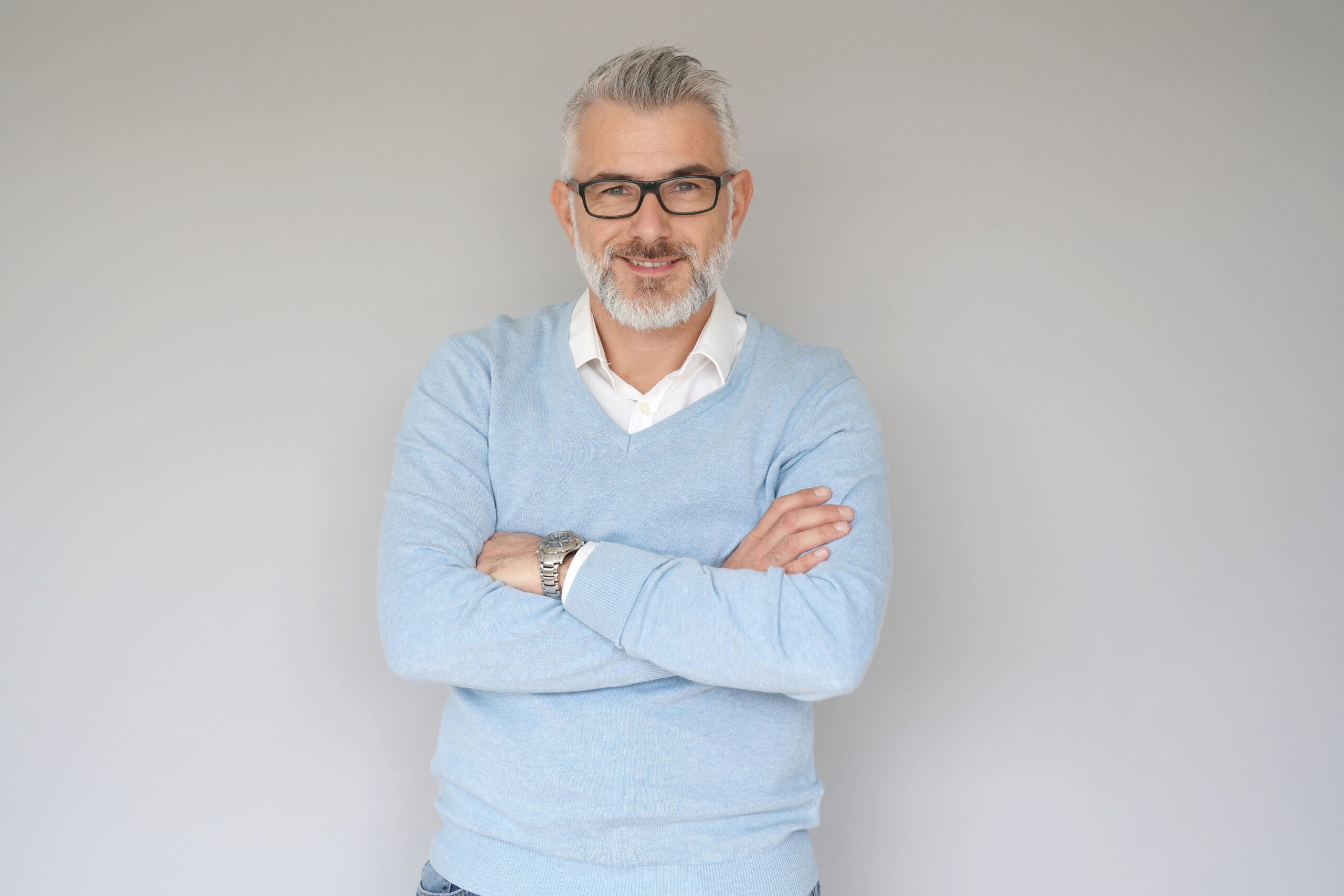 Portrait of 40 year old man, isolated on grey background