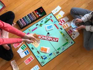use monopoly to teach kids about money